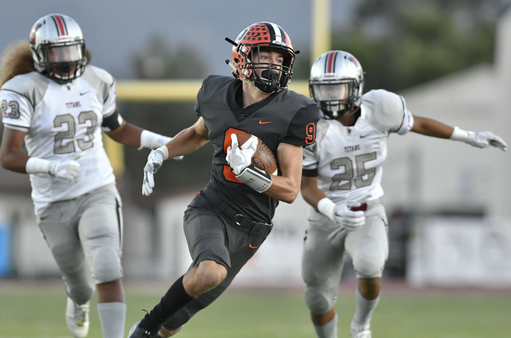 Football: Pirates run away from Titans in second half